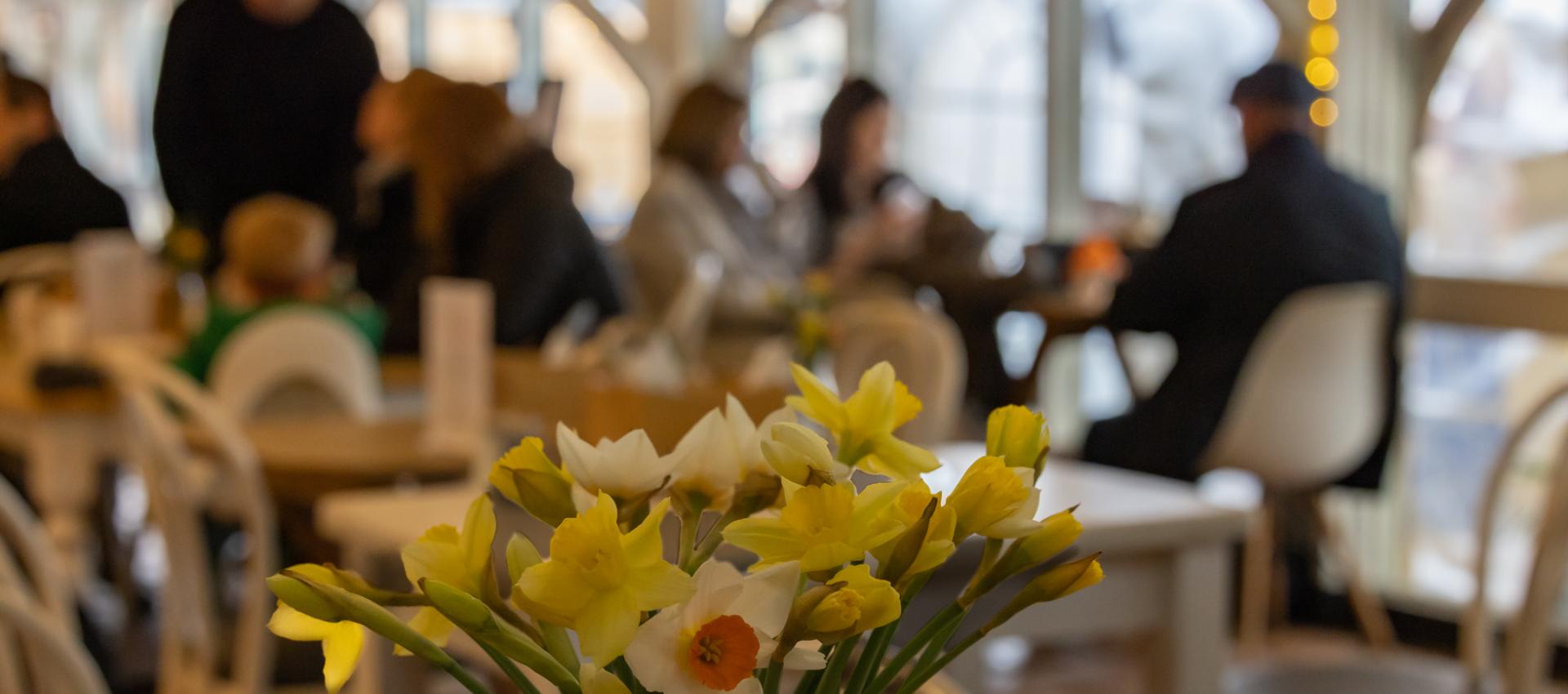 Cogges cafe with a bouquet of daffodils