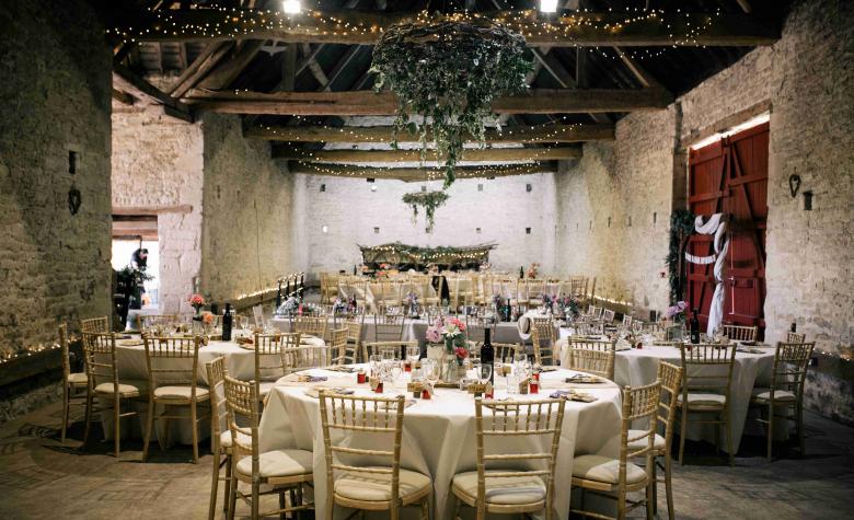  Cogges Barn wedding round table set up