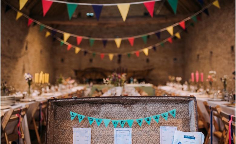 wedding barn tables set up with bunting